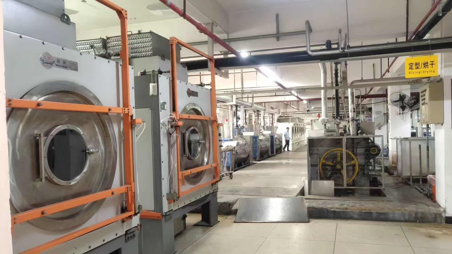 Garment washing facility with washing and drying equipment